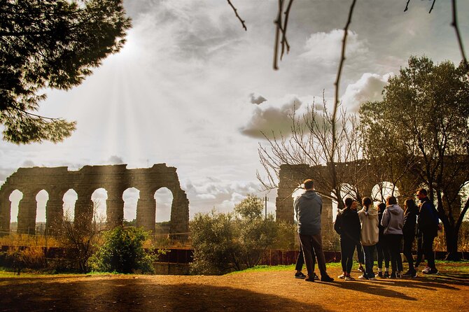 Appian Way Aqueducts Bike Tour with Catacombs & Lunch - Riding into aqueduct country: lunch or aperitif under ancient water lines