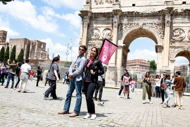 Colosseum Escorted Entrance Combo Pass with Open Bus - Roman Forum + Arch of Constantine: where the city ran
