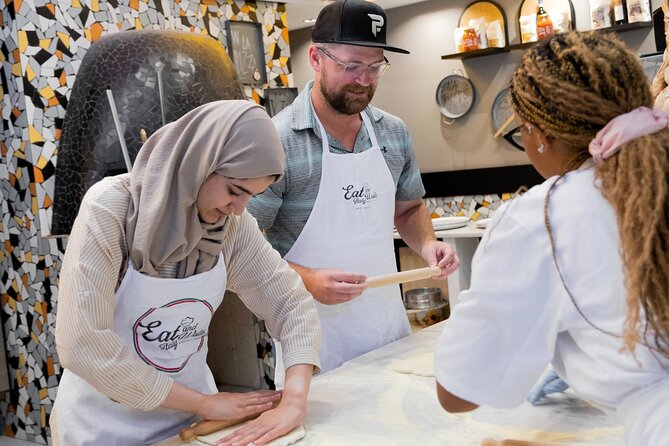 Cooking Class in the Heart of Rome: Pizza and Tiramisu Making - Baking, then sitting down like you earned it