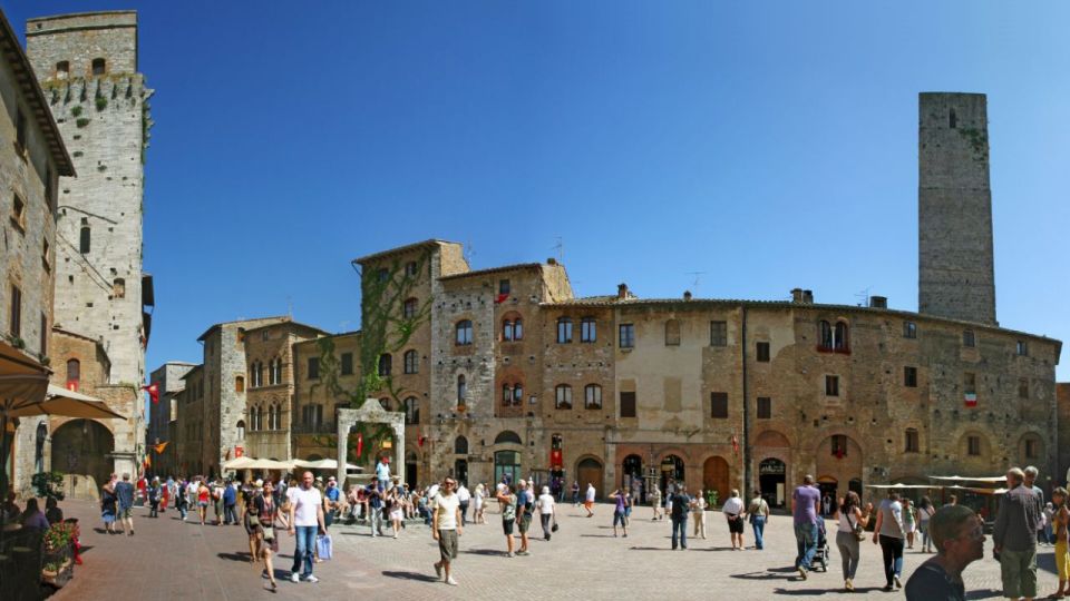 From Rome: Florence & Tuscany Day Tour by High-Speed Train - San Gimignano towers: free time for cobblestones, towers, and gelato