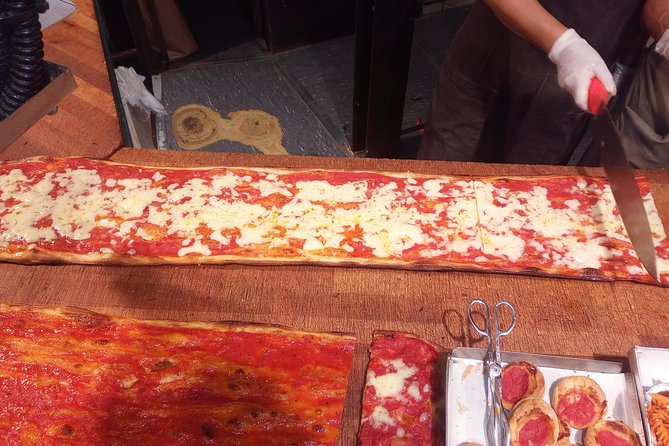 Jewish Ghetto and Campo Dè Fiori By Night Food, Wine and Sightseeing Tour - Campo de’ Fiori at night: pizza margherita, cured meats, and darker square history