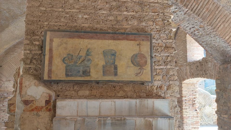 Ostia Antica: Archaeological Guided Private Tour - Baths of Neptune and the Mosaic Question