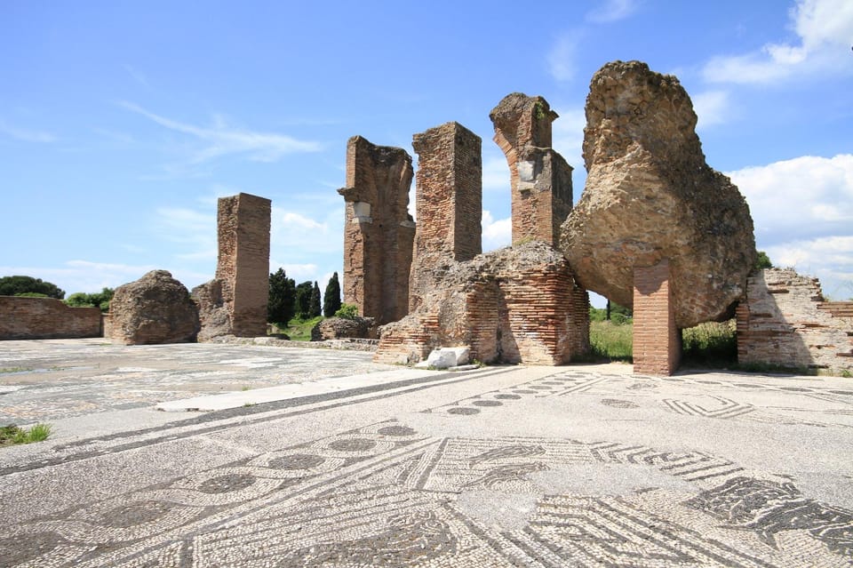Ostia Antica: Hidden City Guided ENGLISH Tour with Transfer - The guided walk: baths, amphitheater, forums, and Mithraic temples