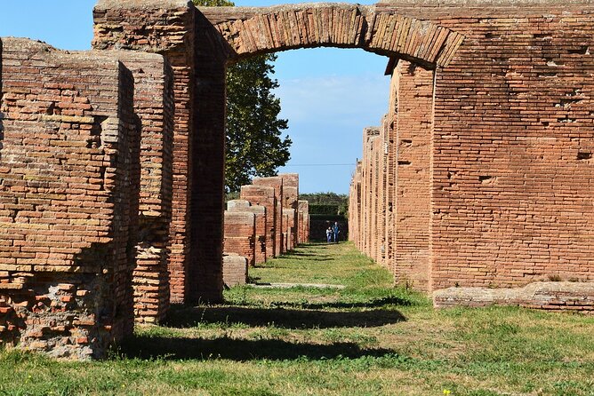 Ostia Antica Private Guided Tour with Optional Transfer from Rome - Terme di Nettuno and the amphitheater zone: mosaics and water culture