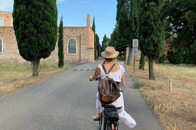 Rome: Appian Way E-bike Tour, Catacombs, Aqueducts & Transfer - Getting on the e-bike at the Appia Antica edge