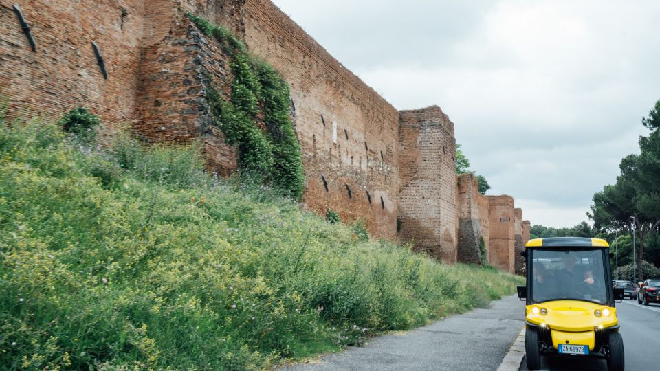 Rome: Appian Way Golf Cart Tour with Roman Catacombs Entry - Walking the Road Romans Used: Tomb of Cecilia Metella and Roman Street-Level Perspective