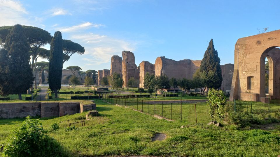 Rome: Appian Way Golf Cart Tour with Roman Catacombs Entry - Aurelian Walls and the Pyramid of Cestius: Ancient Fortification and Instant Visual Wow