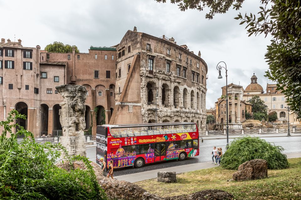 Rome: City Sightseeing Hop-on Hop-off Bus with Audioguide - Colosseum and the nearby classics: where photos are easy and getting off may vary
