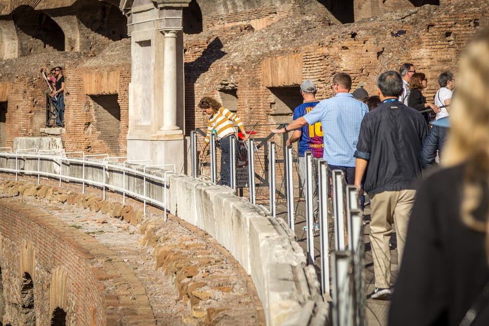 Rome: Colosseum, Forum, & Palatine Hill Entry & Audioguide - Walking the Colosseum with the mobile audioguide