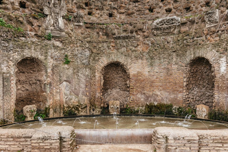 Rome: Colosseum, Palatine Hill & Roman Forum Guided Tour - Roman Forum: Arch of Titus, Caesar’s burial site, and Rome’s swamp-to-power shift