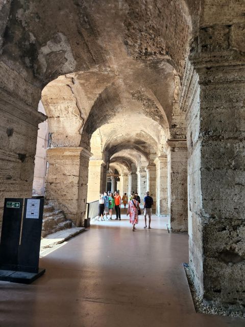 Rome: Colosseum, Roman Forum, and Palatine Hill Ancient Tour - Entering the Colosseum: Rings, Gladiators, and Architecture You Can See