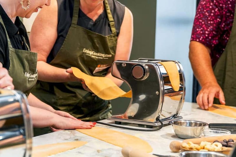 Rome: Hands-On Pasta & Tiramisu Class with Unlimited Wine - Entering a Roman pasta kitchen near the Colosseum