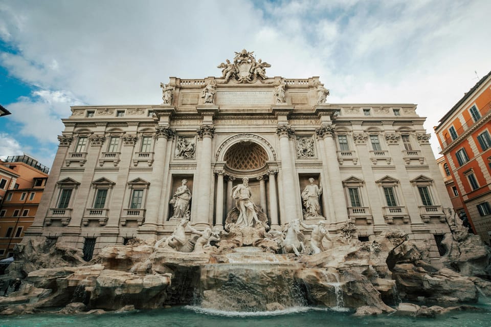 Rome: Historic Squares Guided Walking Tour - Trevi Fountain: Baroque Masterpiece With a Simple Tradition