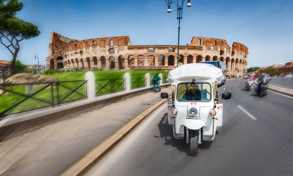 Rome: Private City Tour by Electric Tuk Tuk - Near the Colosseum: Seeing the Scale Up Close