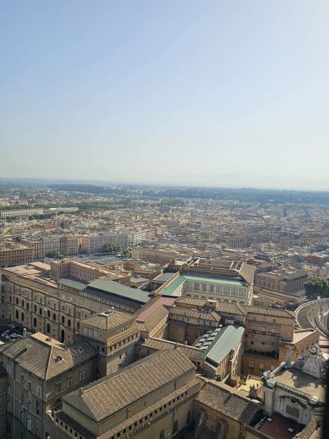 Rome: St. Peter's Basilica and Papal Tombs Guided Tour - Entering St. Peter’s Basilica: marble floors, golden ceilings, and a cross-shaped plan